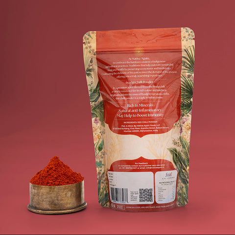 Spice package with red spice on a red background