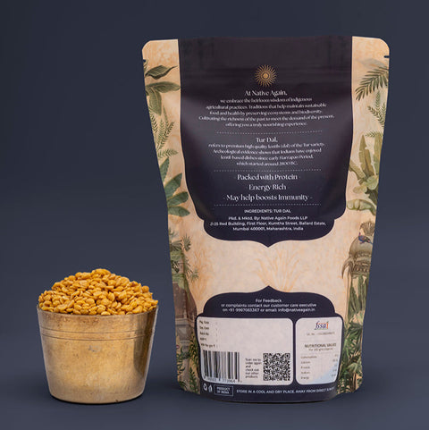 Nuts in a small bowl with a branded packaging bag on a dark background